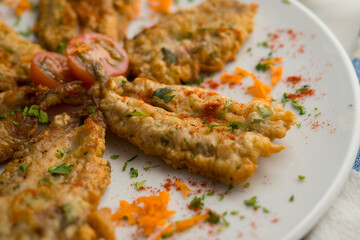 Tapa of anchovies battered with flour and egg in a Spanish restaurant. Traditional tapa of Spanish gastronomy.