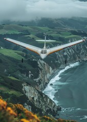 Hang Gliding: A hang glider flying over a picturesque landscape, illustrating freedom and flight. 