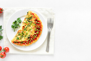 Stuffed omelette with red bell pepper and green onion