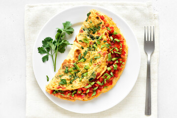Stuffed omelette with red bell pepper and green onion