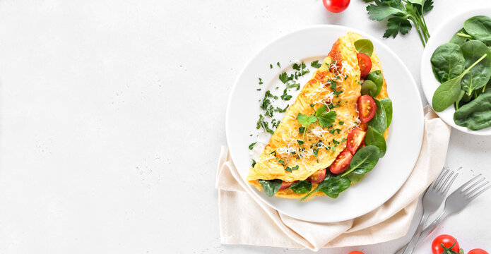 Stuffed omelette with tomatoes and spinach
