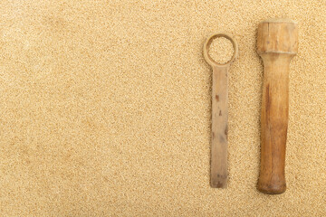 Wooden spoon and masher with amaranth grains