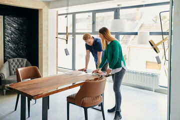 Couple shopping for new furniture in showroom