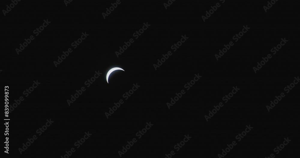 Wall mural moon partially blocking the face of the sun during solar eclipse.