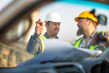Quarry workers checking site plan