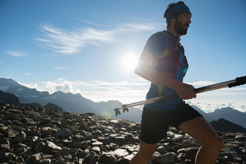 Italy, Alagna, trail runner on the move near Monte Rosa mountain massif