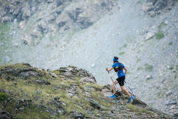 Italy, Alagna, trail runner on the move near Monte Rosa mountain massif