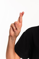 Close-up of a hand making the letter R in Brazilian sign language for the deaf, Libras.