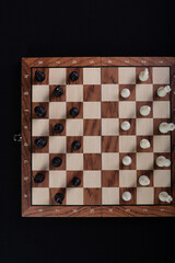 Chess board with pieces. Game concept. Board game. Hobby. Photographed from above.