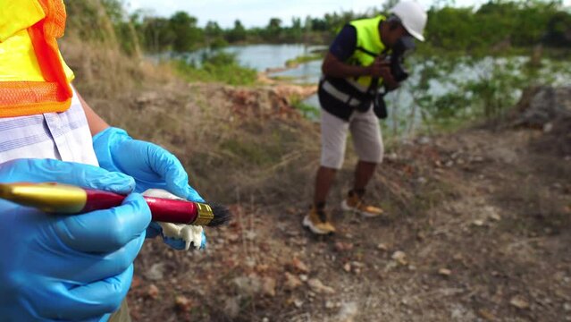Footage 4K: Geologist working at mine exploration site