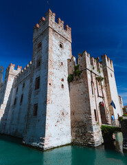 the Castello Scaligero, the most beautiful place of Sirmione, on the lake Garda, during a sunny day - 10 may 2024