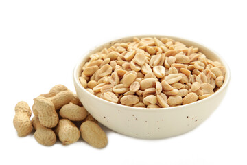 Roasted peanuts in bowl isolated on a white background