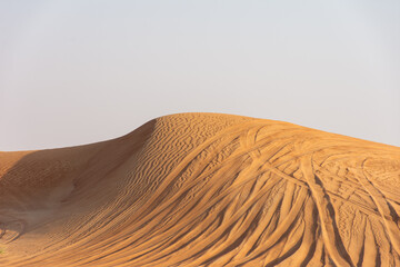 Scenic view of desert against clear sky in Dubai City, UAE.