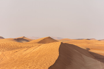 Scenic view of desert against clear sky in Dubai City, UAE.