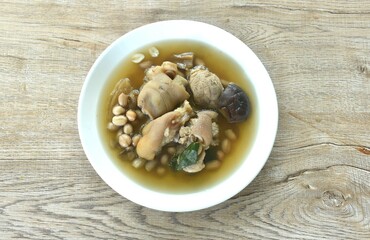 boiled pork knuckle with peanut and ginger with mushroom soup on plate