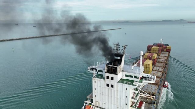 Smoke exhaust gas emissions carbon dioxide from cargo lagre ship container ship,Marine diesel engine exhaust gas from combustion, Gas Emission Air Pollution from transportation. green house effect Eco
