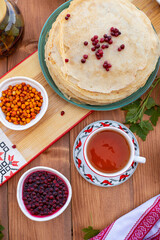 pancakes. thin pancakes or pancakes on a plate. pancakes with berries. Maslenitsa