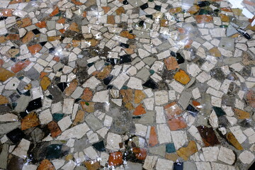 natural stone floor with wet abstract shards. colorful natural stone used for flooring and home...