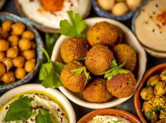 Arab and Middle Eastern delicacies including spicy falafel with chickpeas from a top view
