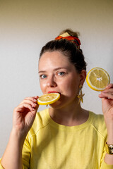 woman eating orange, lemon