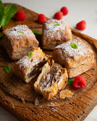 Miguelitos are typical pastries from Spain made from puff pastry, filled with chocolate cream and sprinkled with sugar.