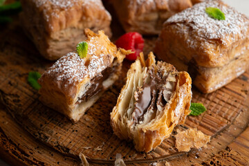 Miguelitos are typical pastries from Spain made from puff pastry, filled with chocolate cream and sprinkled with sugar.