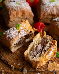 Miguelitos are typical pastries from Spain made from puff pastry, filled with chocolate cream and sprinkled with sugar.