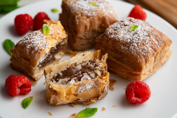 Miguelitos are typical pastries from Spain made from puff pastry, filled with chocolate cream and sprinkled with sugar.