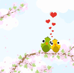 Birds in love on blossom branches