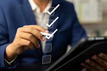 Digital Checklists for efficient business management, Businessman touching marking on checklist...