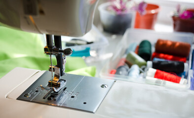 Close-up of a sewing machine and needlework accessories.