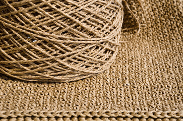 Raffia balls close-up on a burlap background.
