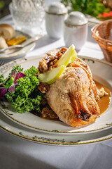 Roasted duck, partially boned, filled with bread stuffing and served with tangy sweet seasonal fruit sauce.