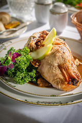 Roasted duck, partially boned, filled with bread stuffing and served with tangy sweet seasonal fruit sauce.