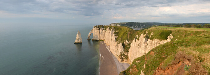 wide panorama of white chalk cliffs with natural arches at the Normandy Channel coast at Etretat  © mikesch112