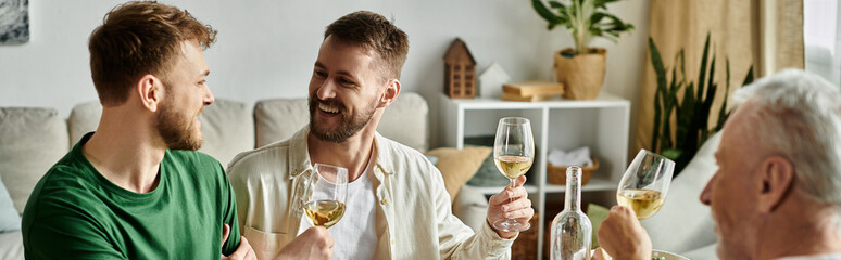 A gay couple toasts with parents at home.