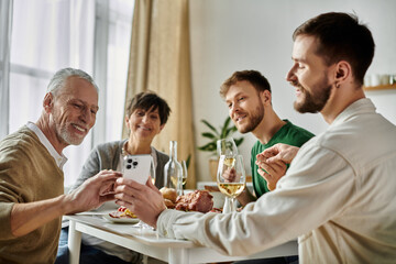 A gay couple shares a meal with parents at home.