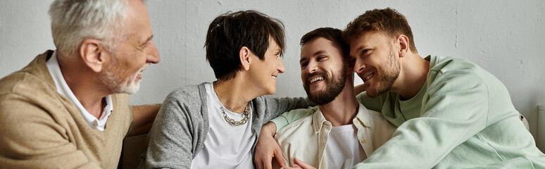 A gay couple meets with parents in a warm, intimate setting.