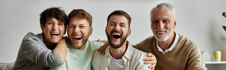 A gay couple shares a joyous laugh with parents, creating a heartwarming scene of family love and...