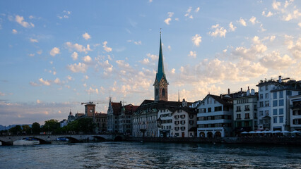 Riverside view of an old European town at dusk