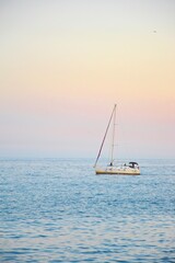 Fototapeta premium sailing boat on the sea sunset