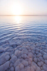 Salt of the Dead Sea. Jordan sunset landscape.
