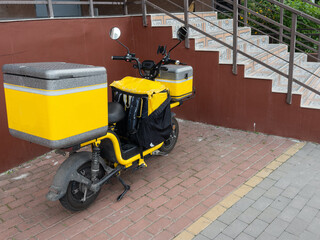  courier bike all painted yellow on road side 