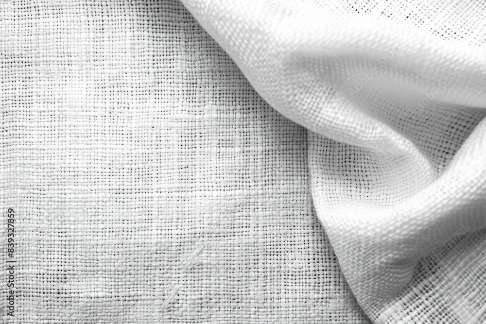 Poster close-up of a white textured fabric with a soft fold, showcasing intricate weave patterns, perfect f