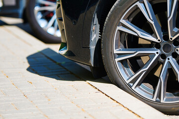 Car tyre close to the curb. Drive up on curb, can get pinched or damaged sidewall. Tyre can crumpl,...