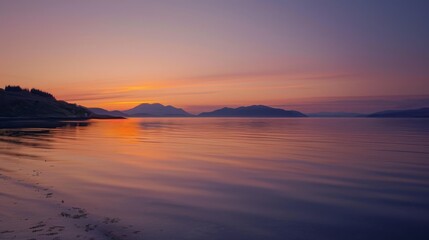 Obraz premium A picturesque sunrise over calm waters, with the first light of dawn painting the sky in soft hues of orange and purple