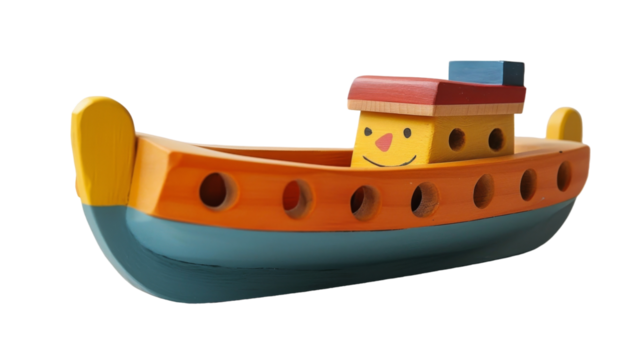 A small, wooden toy boat with a smiling face and red roof