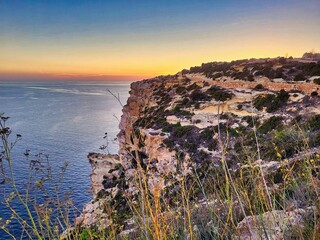 Beautiful landscape with blue sea and rocky shore. Tropical beach with ocean and rocky cape in...