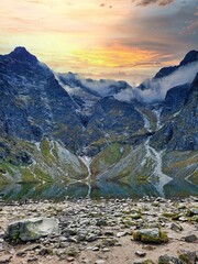 Sunset in the mountains landscape. Green and rural area with a river. Lovcen national park.   Peaks...