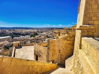 This make a lot of tourists. This one has many interesting views on the roofs of old houses. One can walk around on the ramparts the city.  Christian temples